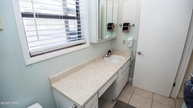 bathroom featuring tile patterned floors and vanity