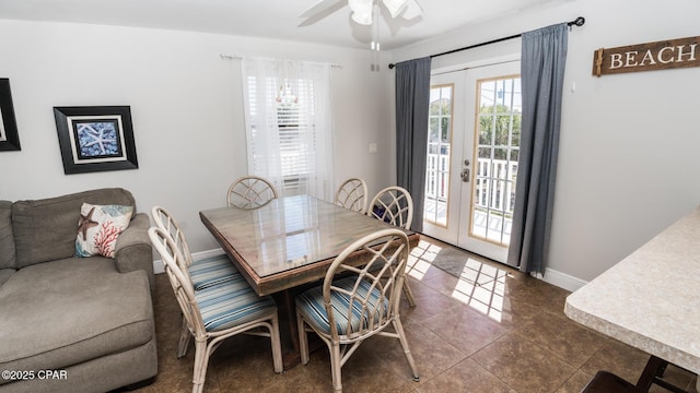 tiled dining area with french doors, baseboards, and a ceiling fan