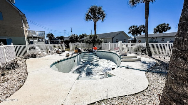 view of pool featuring a fenced in pool, a fenced backyard, and a patio area