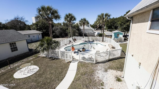 exterior space with a patio, a fenced backyard, and a fenced in pool