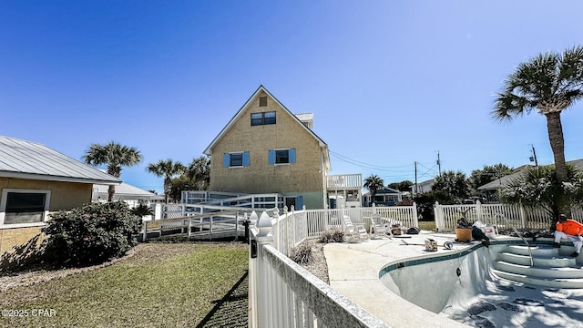 back of house featuring stucco siding, a fenced backyard, and a patio area