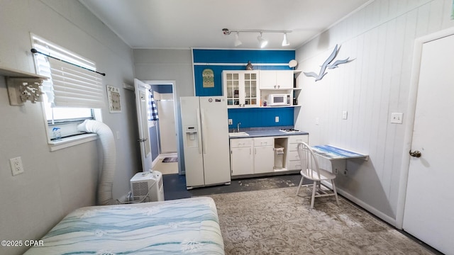 kitchen with glass insert cabinets, concrete floors, white cabinets, white appliances, and open shelves