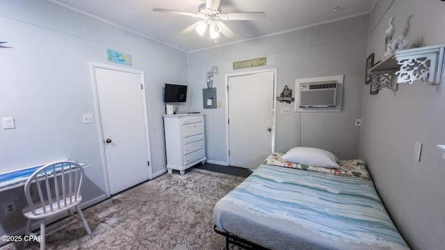 bedroom with crown molding, a ceiling fan, and a wall mounted air conditioner