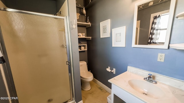 bathroom with baseboards, vanity, toilet, and a shower stall