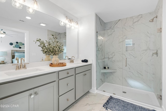 bathroom with marble finish floor, a sink, a marble finish shower, and connected bathroom