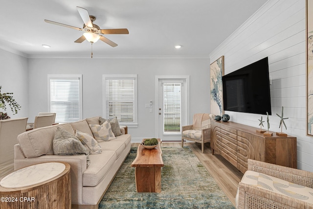 living area featuring ornamental molding, recessed lighting, ceiling fan, and light wood-style flooring