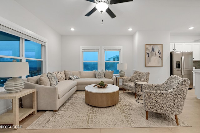 living area featuring a ceiling fan, recessed lighting, and light wood finished floors