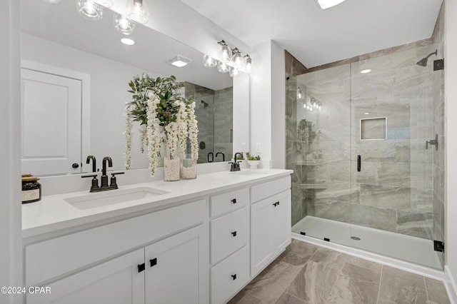 bathroom with a stall shower, visible vents, a sink, and double vanity