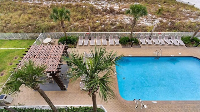 community pool featuring fence