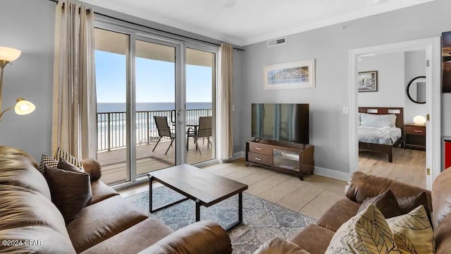 living room featuring light tile patterned floors and baseboards