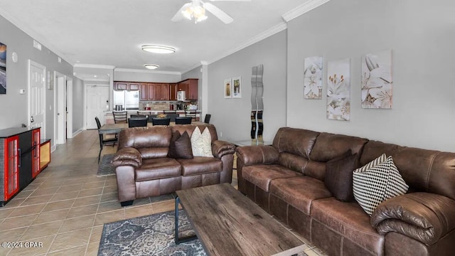 living room with a ceiling fan, light tile patterned floors, and ornamental molding