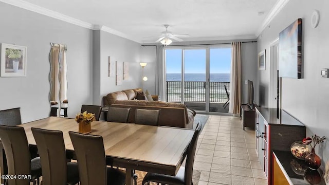 dining space with ceiling fan and crown molding