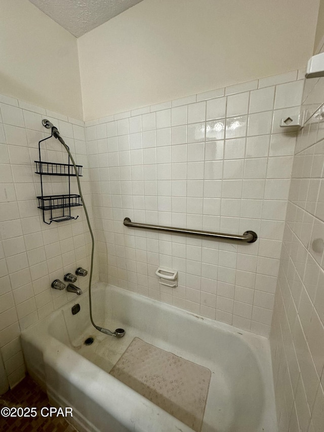 bathroom featuring a shower and a bathtub