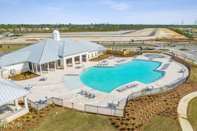 pool featuring a patio area and fence