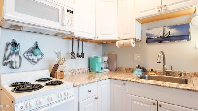 14401 Front Beach Rd Unit 432, Panama City Beach, FL 32413 - kitchen featuring light countertops, a sink, white cabinetry, and white appliances