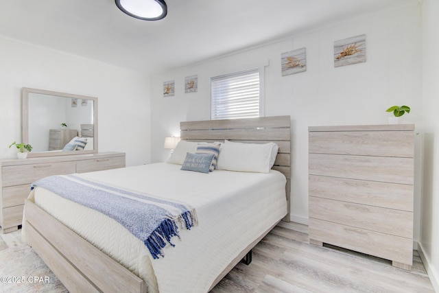 bedroom featuring wood finished floors