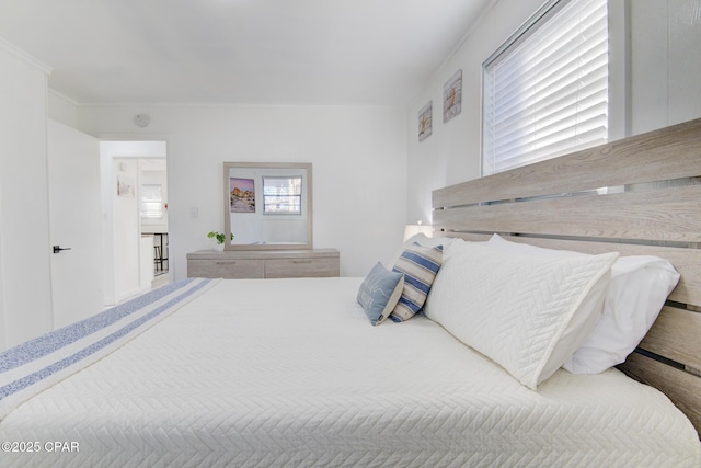 bedroom with crown molding