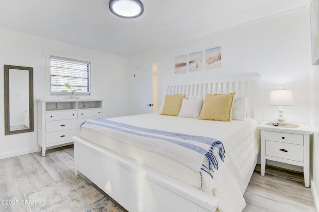 bedroom with light wood-style floors