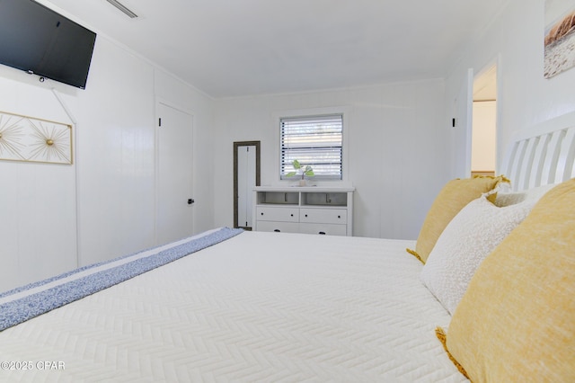 bedroom with crown molding