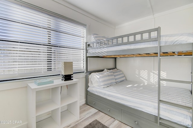 bedroom featuring wood finished floors