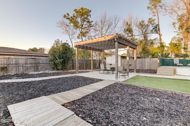 view of yard with a patio area, a fenced backyard, and a pergola