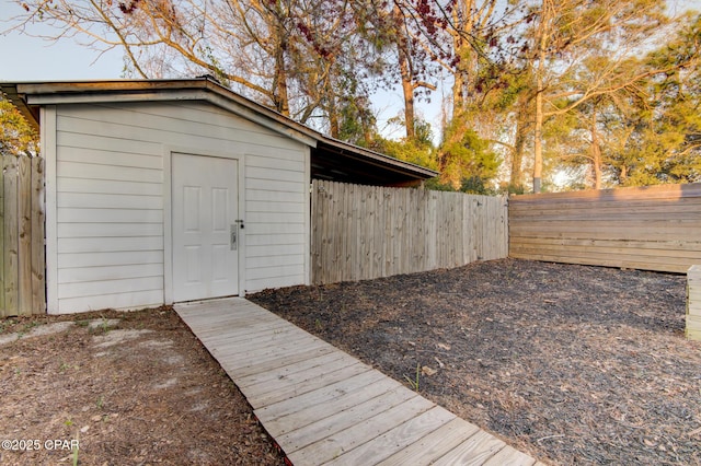 view of shed with a fenced backyard