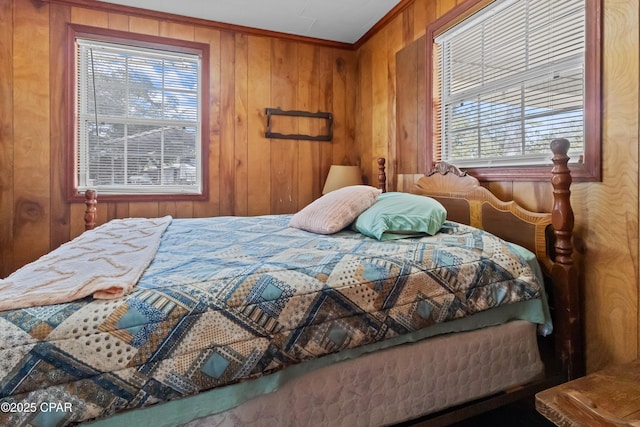 bedroom with wood walls and ornamental molding