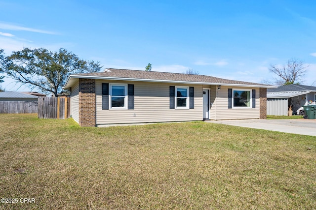 single story home featuring brick siding, roof with shingles, fence, and a front yard