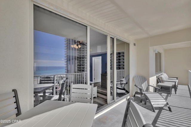 balcony featuring a water view