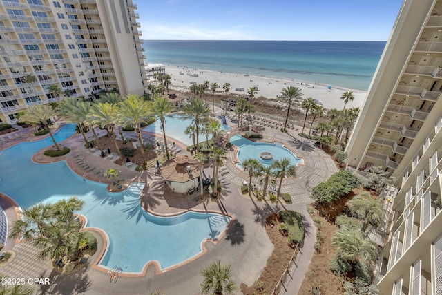 exterior space featuring a water view and a view of the beach