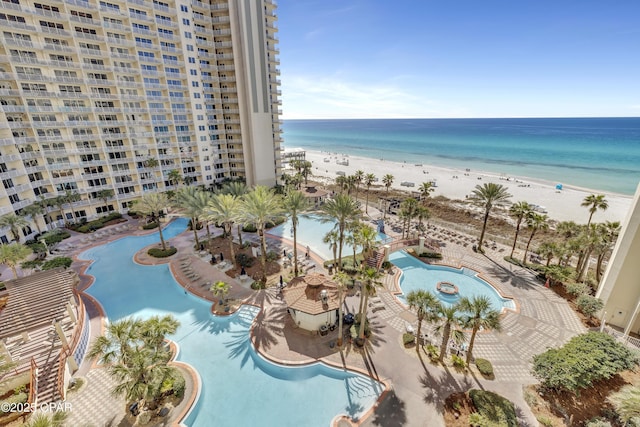 exterior space featuring a beach view and a water view