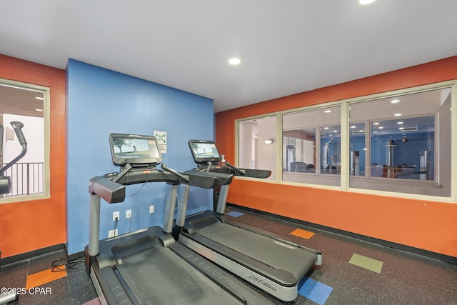 exercise room featuring recessed lighting and baseboards