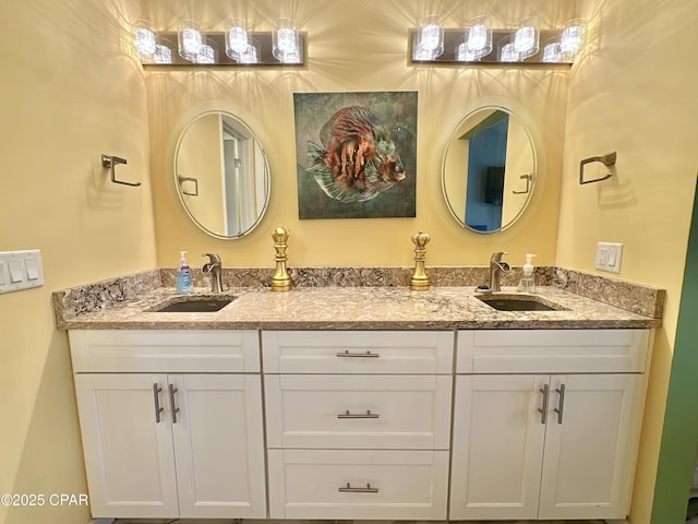 full bathroom with a sink and double vanity