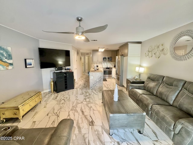 living room with baseboards, visible vents, marble finish floor, and ceiling fan