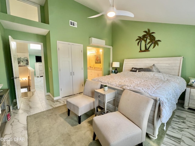 bedroom with visible vents, baseboards, ensuite bathroom, a closet, and marble finish floor