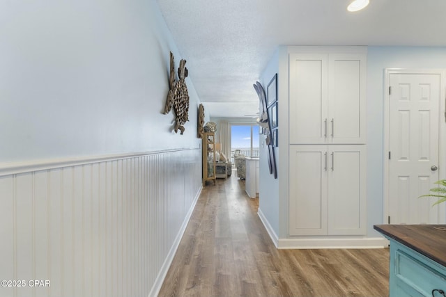 12011 Front Beach Rd Unit 204B, Panama City Beach, FL 32407 - corridor featuring wood finished floors and baseboards