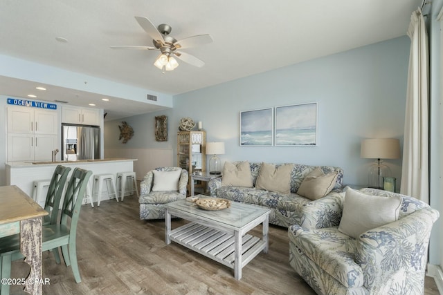 12011 Front Beach Rd Unit 204B, Panama City Beach, FL 32407 - living area with light wood-style floors, ceiling fan, wainscoting, and recessed lighting
