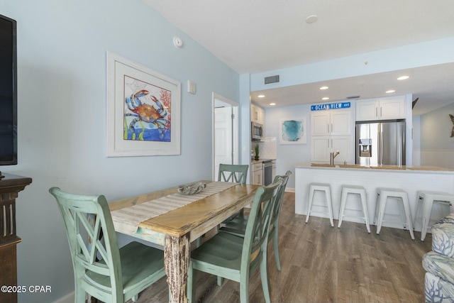 12011 Front Beach Rd Unit 204B, Panama City Beach, FL 32407 - dining space with dark wood-style flooring and recessed lighting