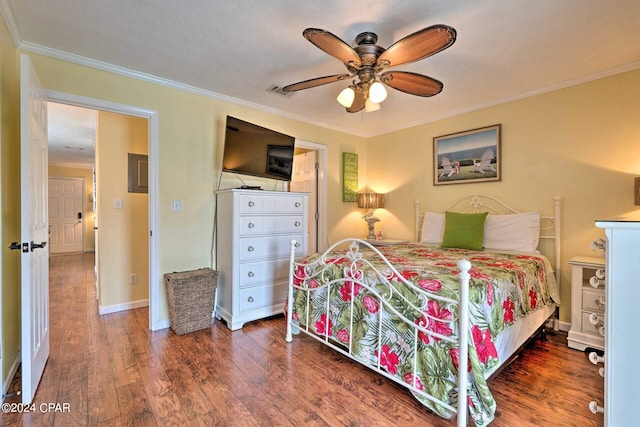 bedroom with ceiling fan, wood finished floors, visible vents, baseboards, and ornamental molding