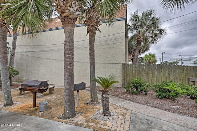 view of patio / terrace featuring fence