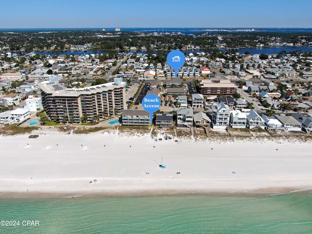 aerial view featuring a water view and a beach view