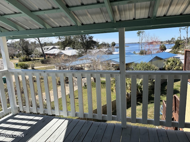 wooden terrace with a water view