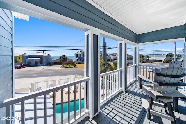 balcony featuring a sunroom