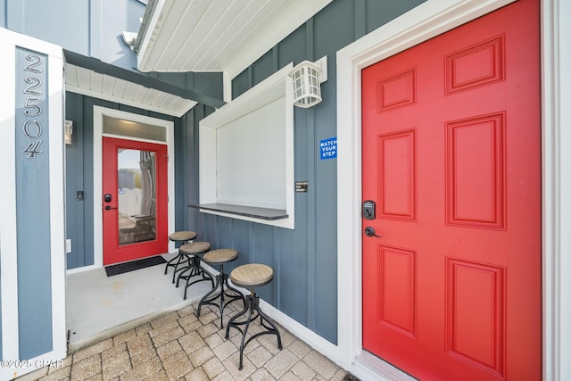 entrance to property featuring a porch