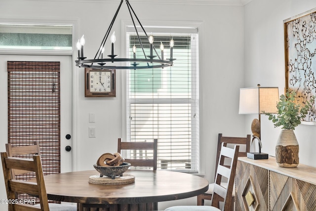 dining space featuring a notable chandelier