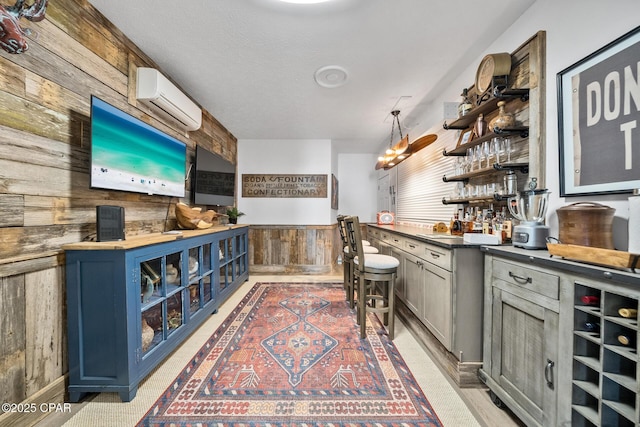 bar with wood walls and a wall mounted AC