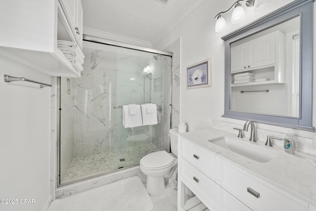 full bath featuring a marble finish shower, toilet, ornamental molding, marble finish floor, and vanity