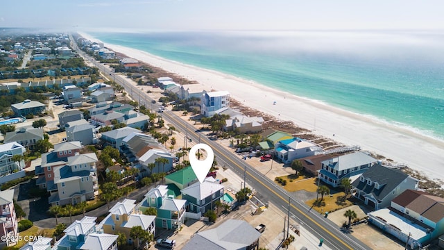 bird's eye view featuring a residential view, a view of the beach, and a water view