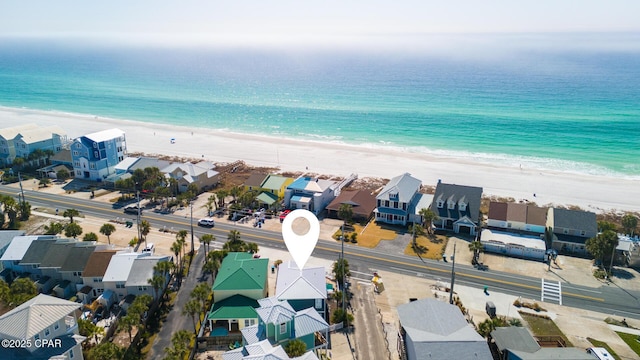 bird's eye view with a residential view, a beach view, and a water view