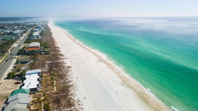 drone / aerial view with a beach view and a water view